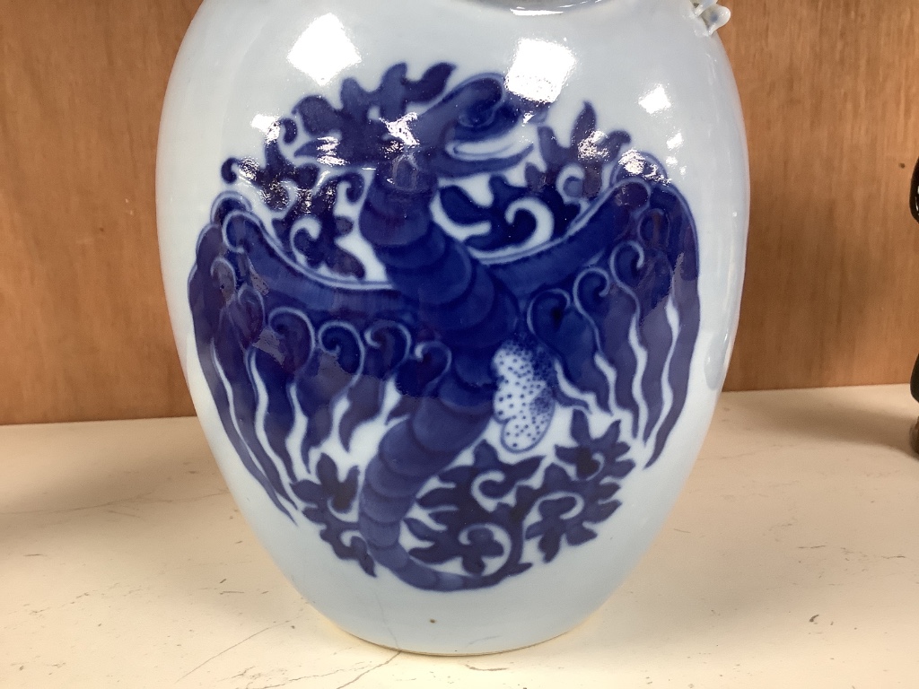 A Chinese blue ground blue and white dragon design vase, 17cm high